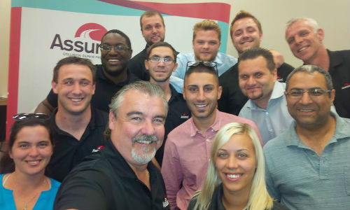 Trainer Jean-Marc Julien (centre) and the latest class to graduate from the Assured Automotive Training Academy.