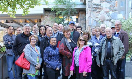 Attendees of the LJ Peters 13th Annual Summit on the steps of the Fairmont Chateau Whistler, prior to the start of the 'Amazing Race' a team building event that saw attendees engage in a massive scavenger hunt around Whistler.