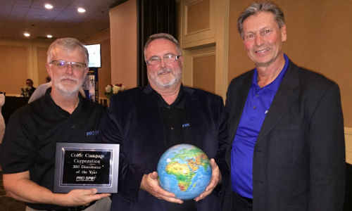 Russell Duncan (centre), Color Compass Corporation's Equipment Specialist, accepting the award from Art Ewing of Pro Spot Canada and Ron Olsson, President of Pro Spot International.