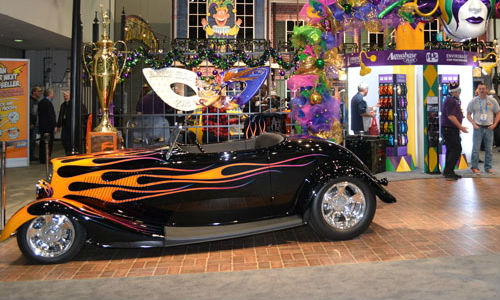 Bobby Alloway won the 2015 Battle of the Builders with this 1933 Ford Roadster, seen here on display at PPG's Mardi Gras themed booth at the SEMA Show.