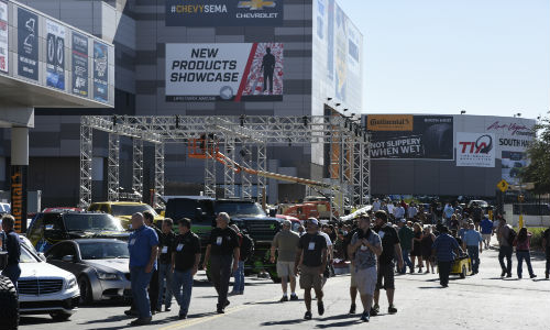 Exhibitors and attendees gather in Las Vegas on Monday before the SEMA Show officially opens.