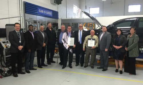 The team at CSN-Automacs Collision receives their certification plaques from Scott Wideman of Volkswagen Group Canada.