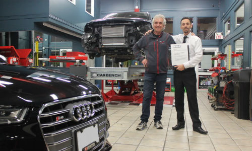 Frank and Franco Gobbato with the Formula First Collision's Audi certification plaque. The facility is the first in the Windsor-Essex area to become an Audi Certified Collision Repair Center.