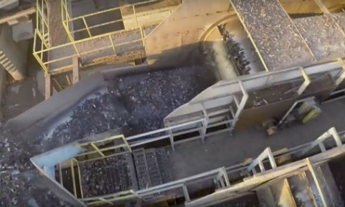 A shredder going full speed ahead. A modern shredder is capable of processing a staggering amount of material per hour.
