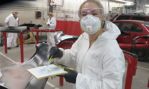 A participant in the Women in Trades Training program at Okanagan College working on a fender. The program helps to encourage women to enter the skilled trades.