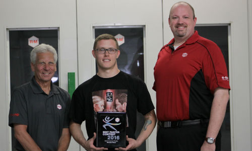 Brandon Rixse (centre) receives his plaque for being named the North American representative for the R-M Best Painter contest from Roger Sipe, BASF Account Representative (left) and Mike Freeman, BASF Market Segment Manager for R-M in North America.