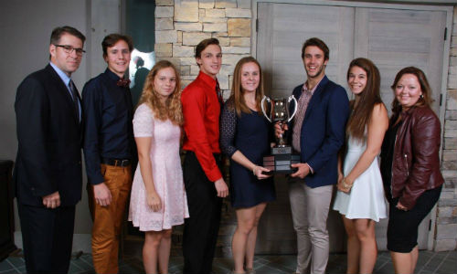 Michel Charbonneau, Uni-Select’s Vice-President of Sales and Marketing, PBE Division and responsible for the Carrossier ProColor business unit (left) with some of the scholarship recipients from the 2015 event.