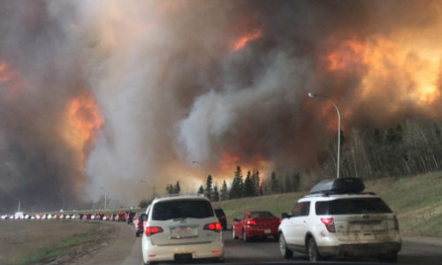 Large flames and heavy smoke surrounded a congested Highway 63 South as residents evacuated from Fort McMurray in early May. Fix Auto franchisees and staff across Canada have stepped up to donate to the Red Cross' Alberta Fires Appeal.