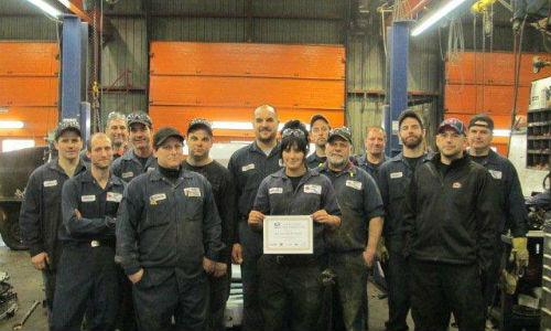 The team at LKQ Lecavalier in Ste-Sophie, Quebec with their Golden Switch Award. The award celebrates five consecutive years of active participation in the Switch Out program.