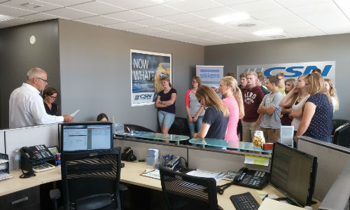 John and Joanne Hutten (far left) conduct a tour of their new facility for students from Emmanuel Christian High School.