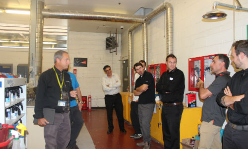 Dave Samalea of Centennial College conducts a tour of the school's autobody labs. Centennial College served as host for the Toyota Collision Repair Conference.