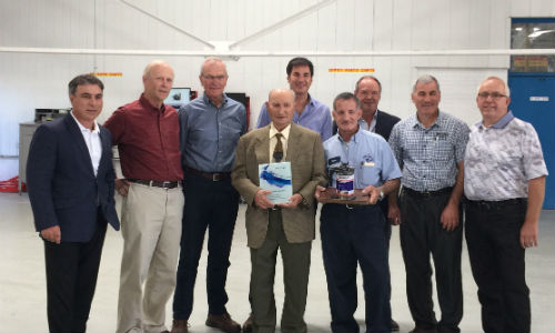 Ralph D'Alessandro, centre, with representatives of AkzoNobel, Treschak Enterprises and CSN-427 Auto Collision. D'Alessandro was recently honoured as the first Sikkens customer in North America.