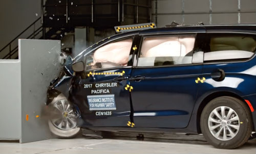 The Chrysler Pacifica during the challenging small overlap front test. The vehicle was retested by IIHS after FCA made changes to prevent the driver's door from opening during this type of collision.