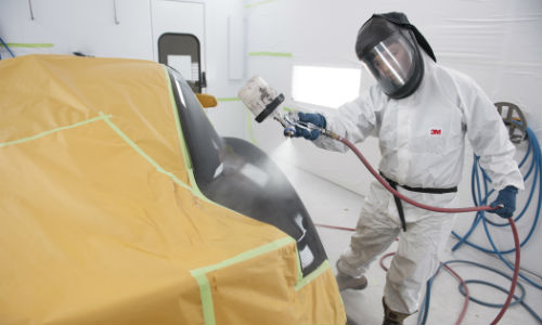 A student at Fanshawe College practices painting techniques. The curriculum standards for Ontario's auto body college programs have recently been updated.