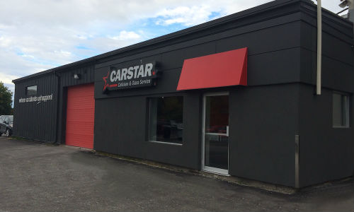 The exterior of CARSTAR Midland. The collision facility is located within the Tom Smith Chevrolet Buick GMC dealership.