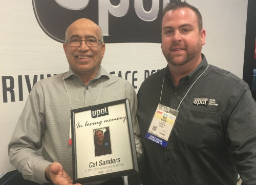  Zubair 'Zuby' Siddiqui of Crescent Industries and Mike Sanders of U-POL, Cal's son, at the 2016 SEMA Show. The plaque depicted honours Cal Sanders. 