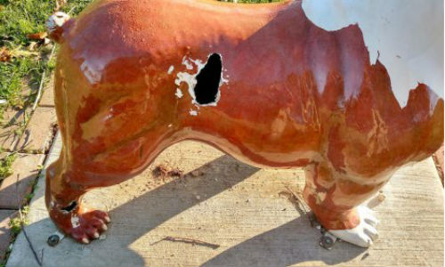 Shop owner John Dixon stepped up to offer free repairs when dandals damaged this bulldog statue at his local dog park.