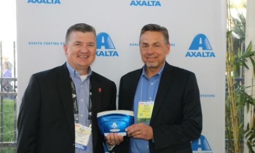 Mike Carr, Axalta's President - North America and Michael Gogoel, President of BYK-Gardner USA with a commemorative spectrophotometer painted with Brilliant Blue, Axalta’s North American Automotive Color of the Year 2016.