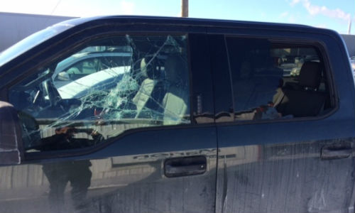 One of the vehicles brought to Marion Auto Body with a smashed window. Photo by Marion Auto Body.
