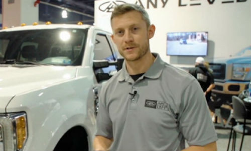 Aaron L. Aldrich of Any Level Lift demonstrates operating the system with the Ride Controller cell phone app at the 2016 SEMA Show. Any Level Lift was the winner of the 2016 SEMA Launch Pad competition.