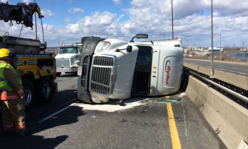 Strong winds blew over a transport truck on the Skyway bridge in Hamilton, Ontario, leading police to close the bridge citing safety concerns. Photo by Kerry Schmidt.