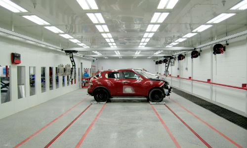 CARSTAR Flint Road's 118-ft. custom GFS prep bay. The bay features two REVO Rapid IR curing systems, as well as a side-load rail and dolly system.