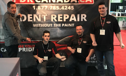 Domenic Serra, Brandon Serra,Eric Lemke and Jake Serra of PDR Canada display the company's new specialized tools for paintless dent repair to aluminum.