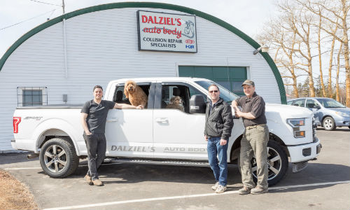 A few members of the Dalziel family and members of the management staff at Dalziel's Auto Body. From left: Chris Dalziel, Operations Manager; Jeff Dalziel, Assistant Manager and John Dalziel, Manager. The dogs, Bella and Ozzie, are not officially on staff.