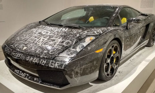 An art piece entitled 'Low Key' on display at a museum in Denmark. Patrons were encouraged to leave their mark on a once-pristine Lamborghini.