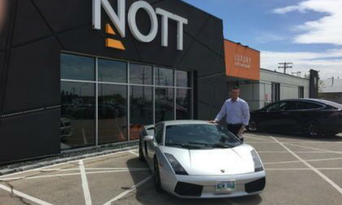 Trevor Nott, President of Nott Autocorp and one of the founders of Winnipeg's new Exotic Driver's Club, with a Lamborghini Galardo Coupe, one of eight cars being offered for rental through club.