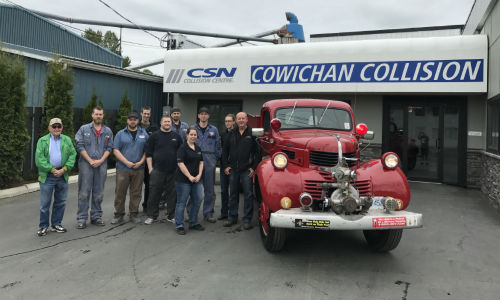 Brian Nicol (left) of the Cowichan Valley Shriners Club accepts the donated fire truck from the team at CSN-Cowichan Collision.
