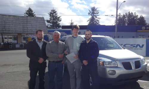 From left: Ryan Pederson and owner Mike MacLaren of CSN-Reliable Auto Body, Theo Devries of Courtenay Fellowship Baptist Church and and Curtus Larson of CSN-Reliable Auto Body. The facility recently donated one of its courtesy vans to the church's youth group.