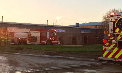 Fire crews respond to a fire at Quality Auto Body & Collision in London, Ontario in mid-April. The shop's co-owner has been charged with arson.