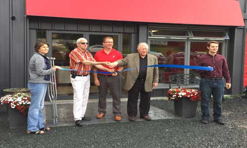 Cutting the ribbon at the CARSTAR Kenora grand re-opening. From Left: Barb Laurin (President, Kenora District Chamber of Commerce) Dave Canfield (Mayor of Kenora) Peter Scheibler (Owner of CARSTAR Kenora) Louis Roussin (Counsillor of Kenora) and Cory Jones (Economic Developer)