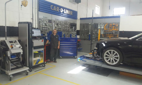 A technician at CSN Automacs show off some of the specific tools and new equipment required by the Audi Hybrid program. The program doesn't just list specifications tools must meet. In most cases, the tools must be of a particular brand.