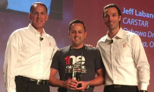 Jeff Labanovich (centre) receives the award for CARSTAR Franchisee of the Year at the 1NE CARSTAR Conference. The award was presented by Dean Fisher, Chief Operations Officer (left) and Michael Macaluso, President of CARSTAR.