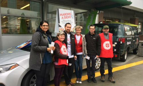 Volunteers from Craftsman Collision, Save-On-Foods and the Salvation Army during the 'Make a Dent' food drive in 2016. Since 2009, Craftsman Collision has helped raise nearly $250,000 for the Salvation Army.