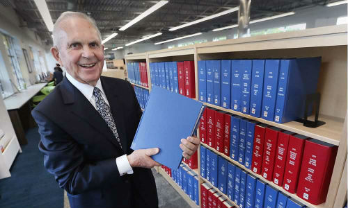 Auto dealer Bill Chisholm at the grand opening of the William F. Chisholm library branch in Windsor, Ontario. The new branch serves as the home for a truly massive collection of automotive history, including original service manuals for the Ford Model T and other vintage vehicles.