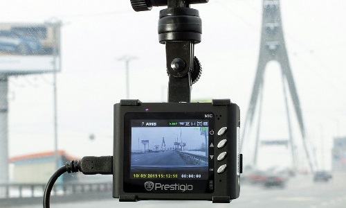 A dashboard camera on the inside of a vehicle’s windshield.