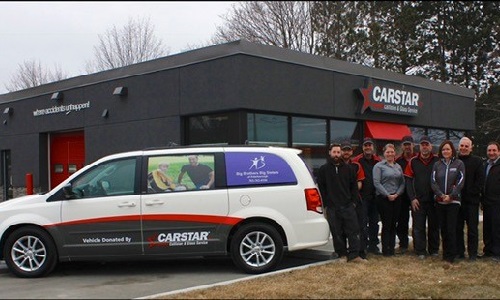 The CARSTAR Peterborough team with the van they donated to Big Brothers Big Sisters.