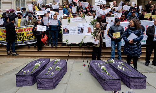 Taxi drivers protest against Uber and Lyft in New York. Each coffin represents a taxi driver who has recently taken their life.