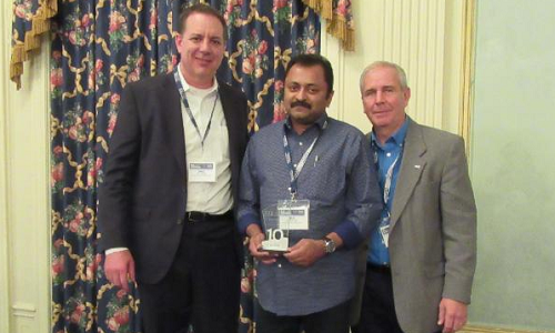 FAN awarded the 10-year Milestone Award to Speedy Auto Service Edmonton Millwoods owner Biju Abraham