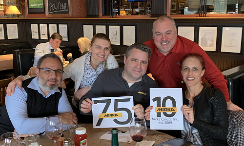 Mirka Canada president Edward John Booth, centre, and the Mirka Canada team celebrate milestone anniversaries for both the company, and its company and its Finland-based parent company.